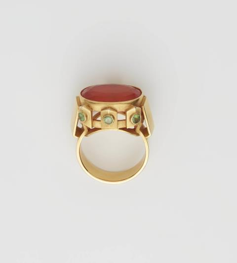 A German 18k gold fire opal and peridot ring.