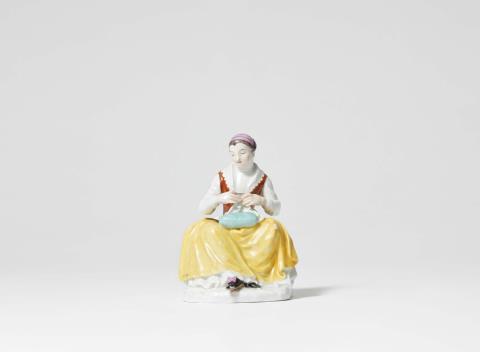 Johann Friedrich Eberlein - A rare Meissen porcelain figure of a seamstress