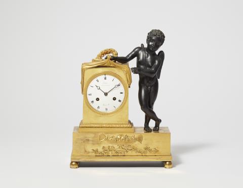 A Parisian gilt and patinated bronze pendulum clock with Cupid revealing time