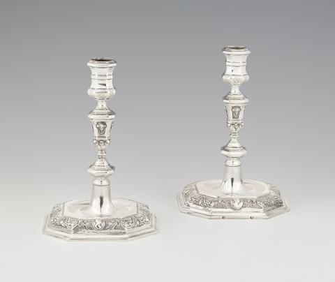 A pair of Régence Augsburg silver candlesticks