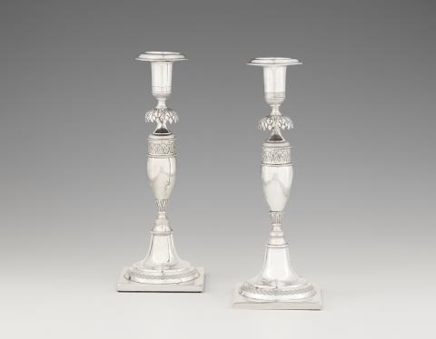A pair of Berlin silver candlesticks