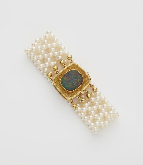 Elisabeth Treskow - A woven cultured pearl bracelet with an 18k gold and black opal clasp.