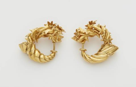 Otto Jakob - A pair of German 18k gold "cornucopia" hoop earrings.