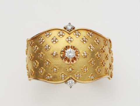 An 18k gold diamond cuff bangle