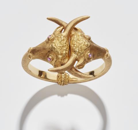Ilias Lalaouins - A textured Greek 18k gold and ruby bull head bangle.