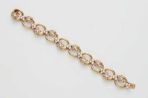 A French 18k gold and diamond chain bracelet.