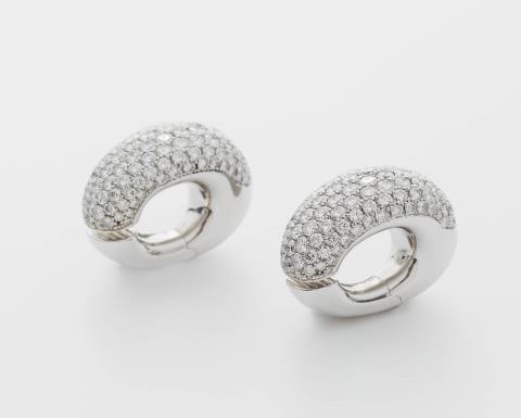 Georg Hornemann - A pair of German 18k white gold and pavé-set diamond clip earrings.