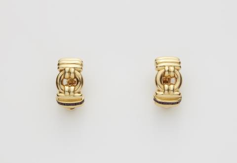 A pair of Italian 18k gold ruby resp. sapphire clip earrings.