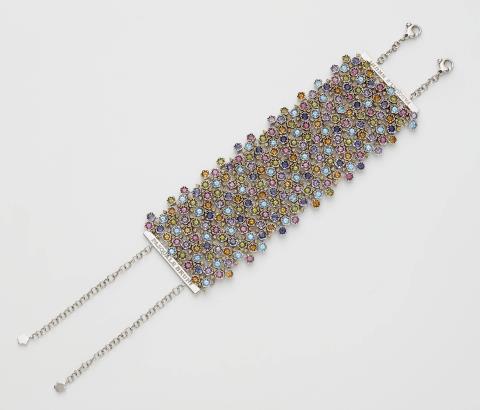 An Italian 18k white gold and coloured gemstone smooth meshwork cuff bracelet.
