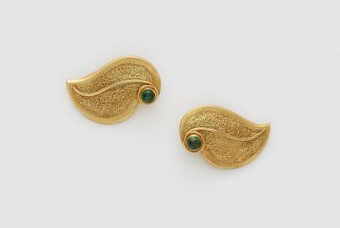 Wilhelm Nagel - A pair of German 18k gold granulation and emerald cabochon clip earrings.
