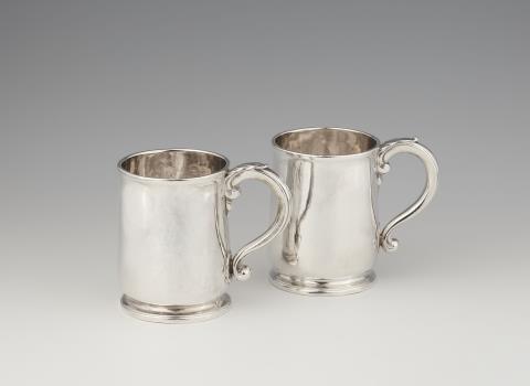 A pair of George I silver mugs