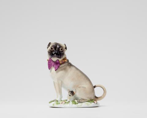 Peter Reinicke - A Meissen porcelain model of a female pug dog with pup