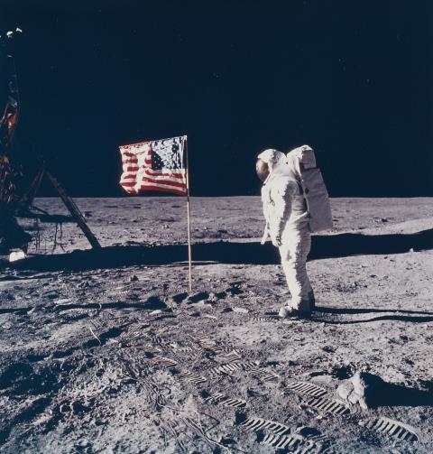 NASA - Astronaut Edwin E. Aldrin Jr. poses for a photograph beside the deployed United States flag, Apollo 11