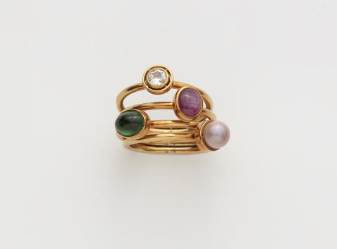 Paul Günther  Hartkopf - A set of four 18k gold gemstone and natural pearl rings.