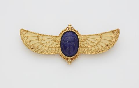Renate Wander - An 18k gold filigree granulation and lapis lazuli winged scarab brooch.
