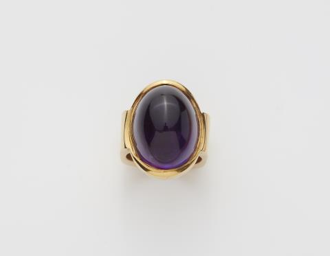Trude Wimmer - A German 18k gold and sugarloaf-cut amethyst ring.