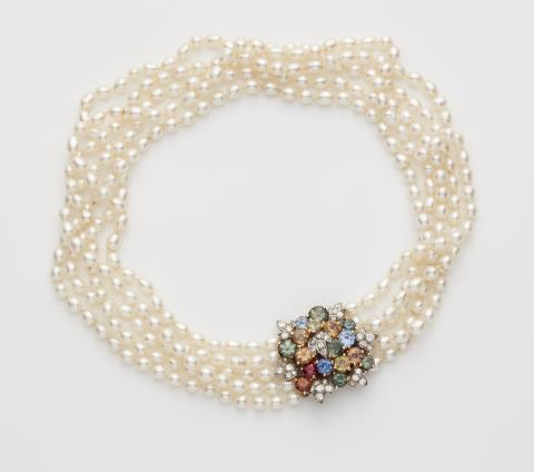René Kern - A five strand cultured freshwater pearl necklace with an 18k gold diamond and coloured sapphire clasp.