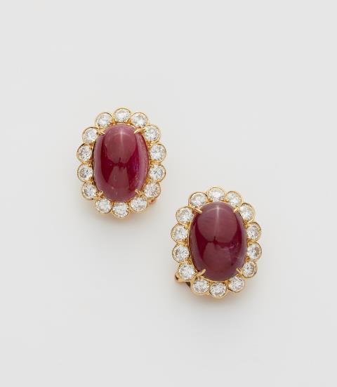 Van Cleef & Arpels - A pair of French 18k yellow gold "Genre Cambridge" diamond and ruby cabochon clip earrings.