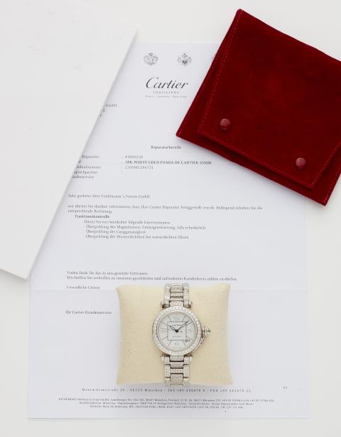 Cartier - An 18k white gold and diamond set automatic Cartier Pasha wristwatch.
