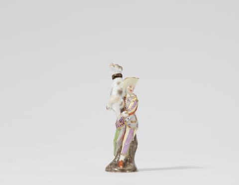 A Meissen porcelain snuff bottle formed as a figure of harlequin with a dog