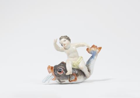 Johann Friedrich Eberlein - A Meissen porcelain figure of a putto on a dolphin