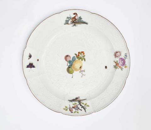  Meissen Royal Porcelain Manufactory - A Meissen porcelain dish painted with a fruit still life and a dog