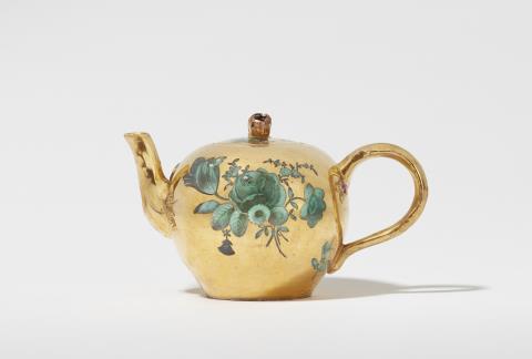 A Meissen porcelain tea pot with flowers in copper green