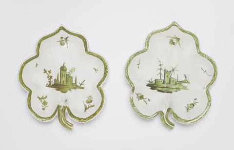  Proskau - A pair of Proskau faience leaf rim dishes with architectural motifs