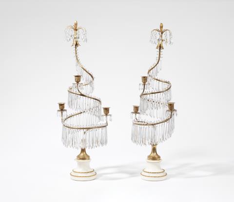  Werner & Mieth - A pair of three-flame bronze candelabra