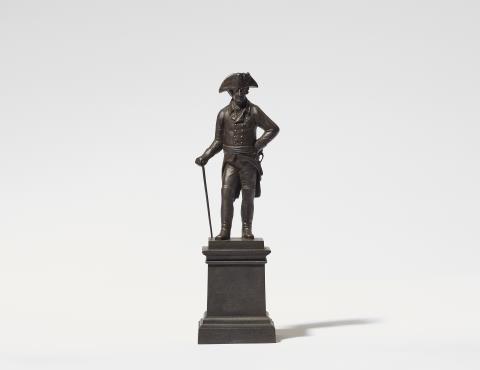  Königliche Eisengießerei Berlin - A cast iron statuette of King Friedrich II on a plinth