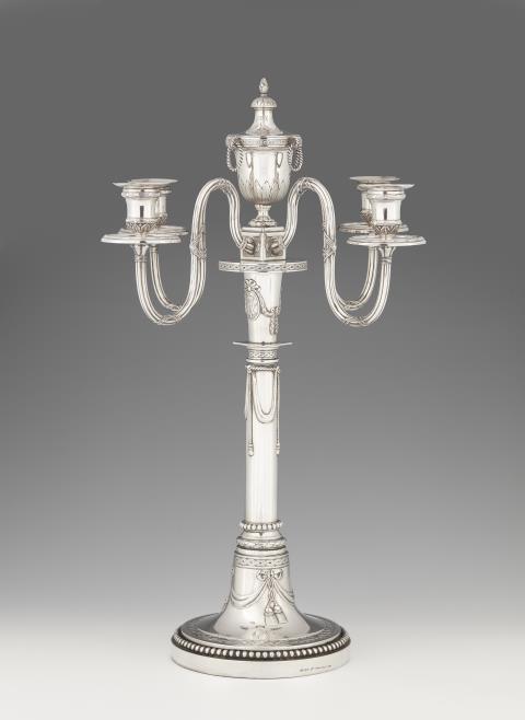  Körner & Proll - A Berlin silver four flame candelabrum from the court inventory of William II. Engraved in two medallions with the monograms of William II and Auguste Viktoria. Marks of Fa. Körner & Proll, ca. 1900.