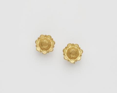 Rolf Goldschmitt - A pair of German 14k gold granulation screw earrings.