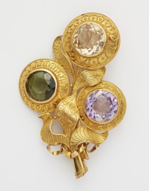 Rolf Goldschmitt - A German 18k gold granulation and coloured stone flower brooch.