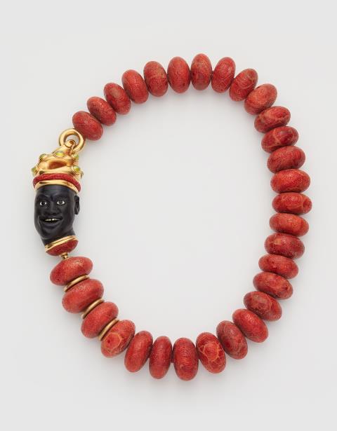 Otto Jakob - A red foam coral necklace with a one of a kind 18/21k gold, carved ebony and chrysoberyl cat's eye sculptural head clasp.