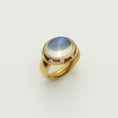 Dagmar Stühler - A hand forged 18k gold and diamond ring with large moonstone cabochon.