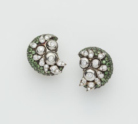 Marilyn F. Cooperman - A pair of American 18k gold Sterling silver tsavorite and diamond clip earrings.