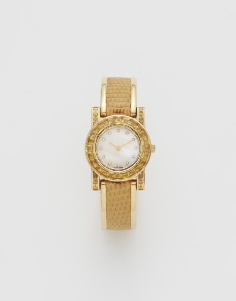 Gebrüder Hemmerle - An 18k yellow gold and yellow sapphire Hemmerle ladies' wristwatch.