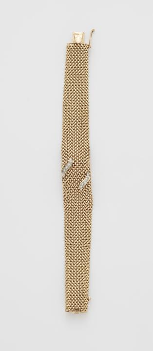 Longines - A 14k gold mesh and diamond bracelet with concealed Longines ladies watch.