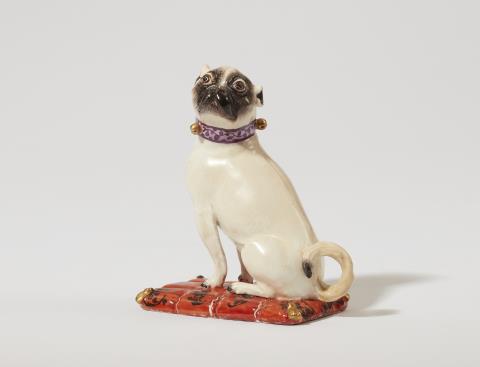  Meissen Royal Porcelain Manufactory - A Meissen porcelain model of a pug dog on a cushion