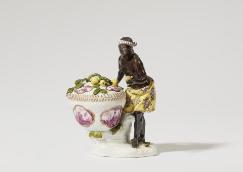 Johann Friedrich Eberlein - A Meissen porcelain figure of an African woman with a basket