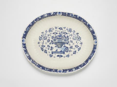  Strasbourg - An oval Strasbourg faience dish with decor in the manner of Bérain