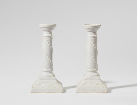  Proskau - A pair of Neoclassical Proskau faience candlesticks
